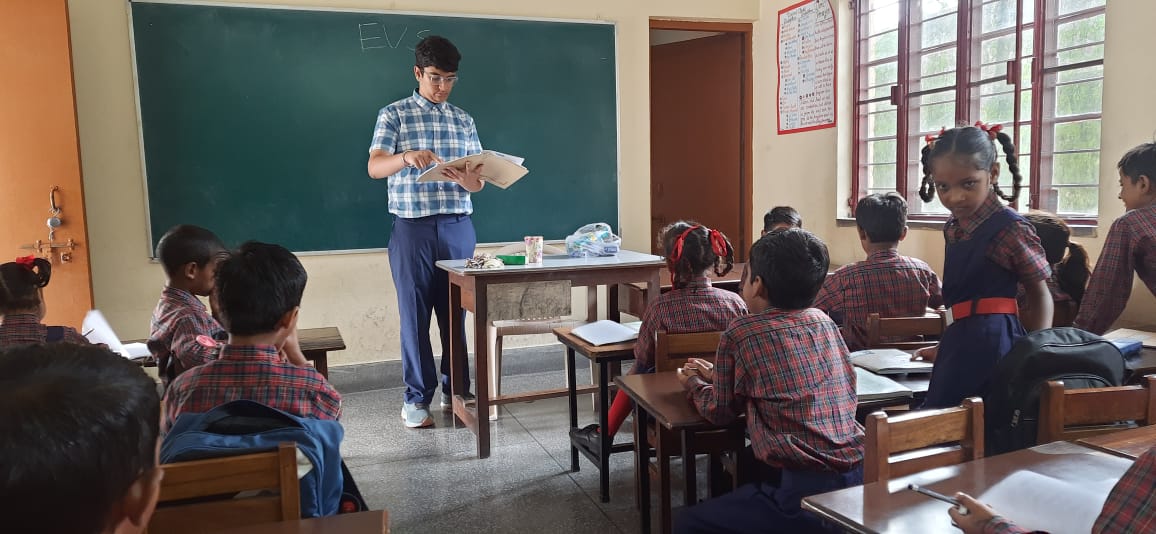 Mihir teaching students at Sharp Memorial School
